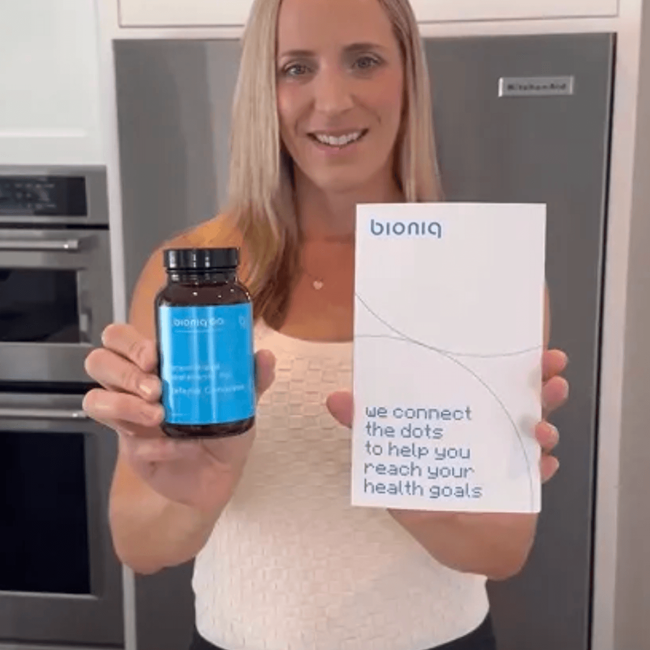 Portrait of customer showing Bioniq products